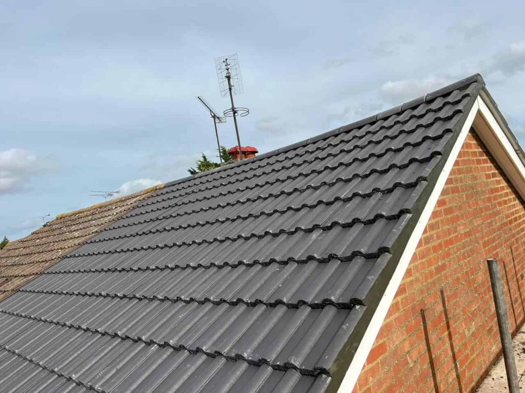 This is a photo of the gable end of a roof with newly installed roof tiles, and it also shows the new facias and soffits.